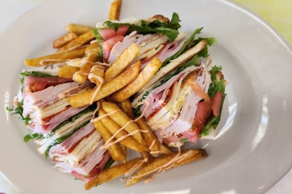 club sandwich han and turkey ,bacon lettuce and tomatoes